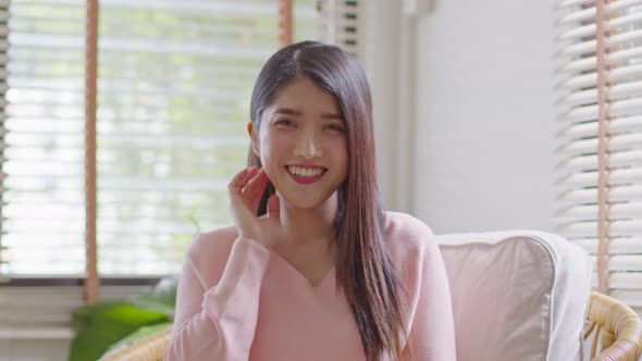 Stunning Beautiful Attractive Asian young woman looking at camera and smile alt