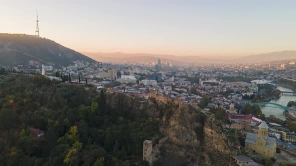 Aerial hyperlapse of beautiful cityscape of Tbilisi at sunset, Georgia alt