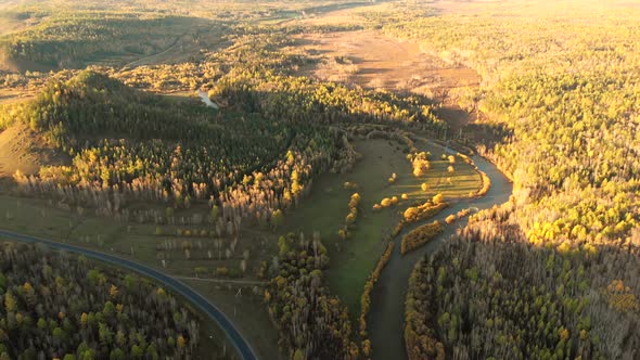 Amazing Aerial Panorama From Drone Over a River, Fall Forest, Hill and Village