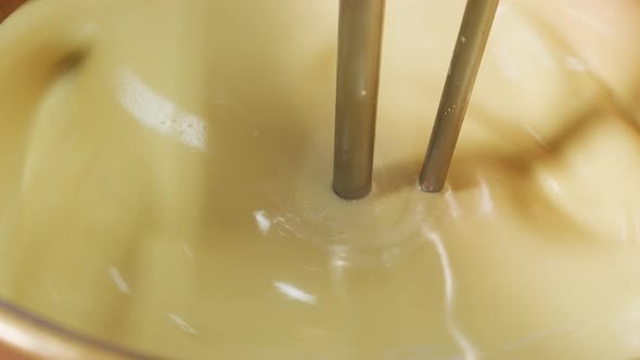 Mixing ingredients for chocolate fudge at candy factory