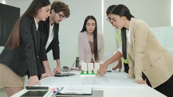 The architect team is brainstorming to help plan a successful machine building.