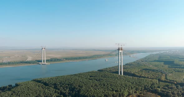 Panorama Of The Braila-Tulcea Suspension Bridge Over Danube River In Romania. aerial alt