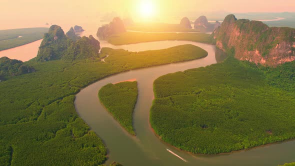 Aerial view from a drone over many islands at Phang Nga Bay during sunset time alt