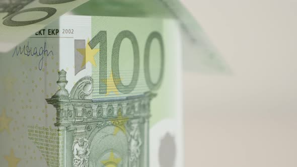 Real estate building metaphor using EU 100 paper money slow tilt 4K 2160p 30fps UltraHD    footage - alt