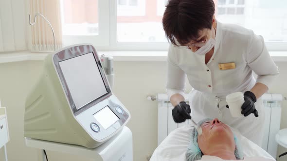 Woman Receiving HUFU Therapy High Intensity Focused Ultrasound Treatment on Face alt