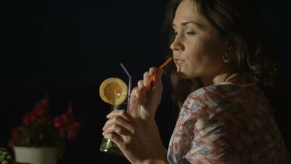 Seductive Elegant Lady Drinking Cocktail in Bar at Night, Enjoying Good Memories alt