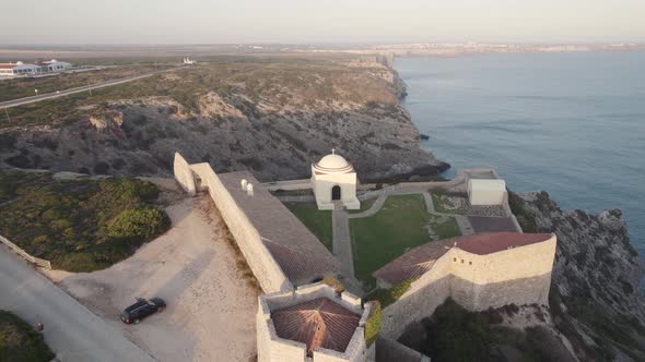 Fly over Fort of Santo Antonio de Belixe, Algarve. Cliffs along Atlantic Ocean. alt