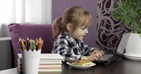 Girl Doing Online Homework Using Digital Laptop Computer. Distance Education alt