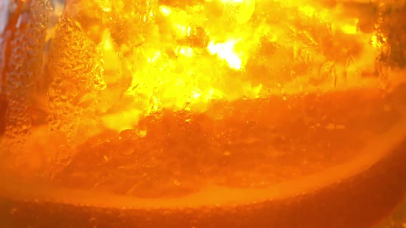 Refreshing orange drink in the sun - 180fps alt