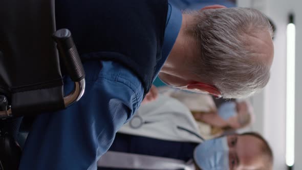 Vertical Video Male Patient in Wheelchair Doing Consultation with Medic alt