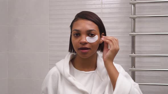 Young Beautiful Woman Uses White Eye Patches Antiwrinkle