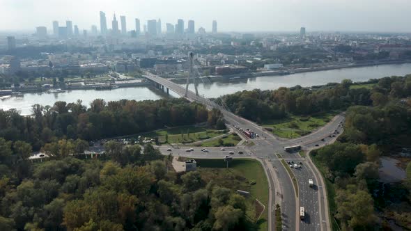 Aerial drone view of Warsaw skyline, Vistula river, Świętokrzyski Bridge and road junction in the fo alt