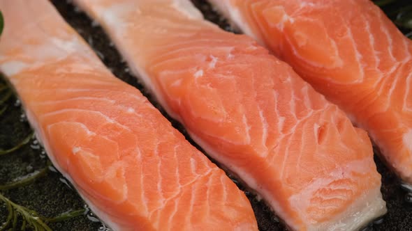 Fry Salmon fish fillet close up. Cooking fish on pan. Sliding shot. 4K UHD video alt