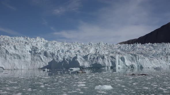 Melting glacier in Antarctica. Landscape of snowy mountains and icy shores in Antarctica. alt