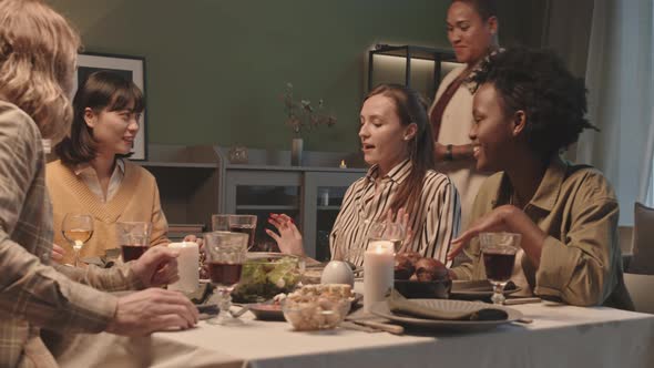 Woman Serving Roast Chicken on Party alt