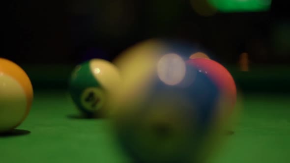 Motion Past Balls on Pool Table Covered with Green Fabric alt