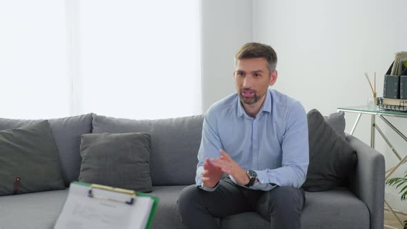 Emotional Smiling Man Patient with Mental Health Problem Talking to Therapist alt