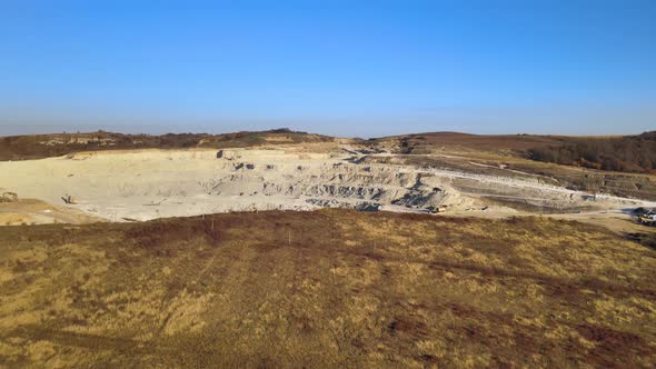 Aerial View of Open Pit Mine of Sandstone Materials for Construction Industry with Excavators and alt