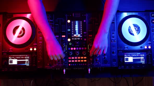 Setting Up Digital Mixing Console with Hands of DJ Top View alt