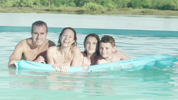 Family together on float in water