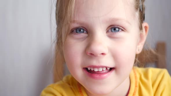 Little Girl Smiles at Home