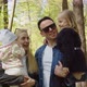 Happy Mom Dad With Small Children In His Arms In The Park - VideoHive Item for Sale