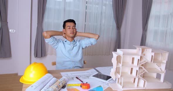 Relaxing Young Architect Man With An Architectural Project alt