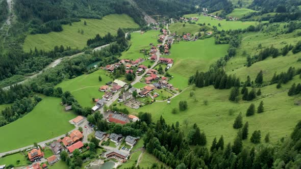 Scenic Aerial View of Mountain Village in Alpine Countryside in Bavaria, Germany