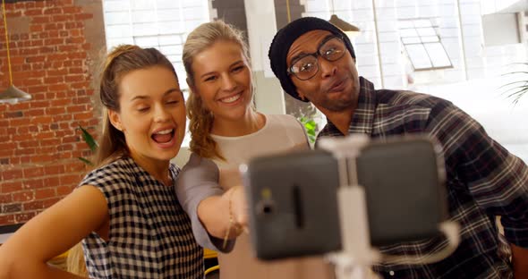 Executives taking selfie with mobile phone 4k alt