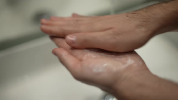 Closeup Male Hands Rubbing Shave Foam in Palms in Slow Motion alt