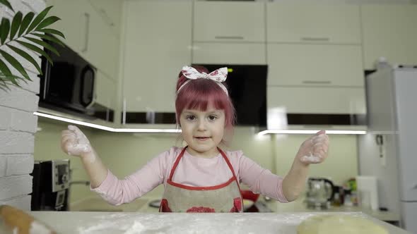Cooking Pizza. Little Child Playing with Flour Gets Her Hands Dirty in Kitchen alt