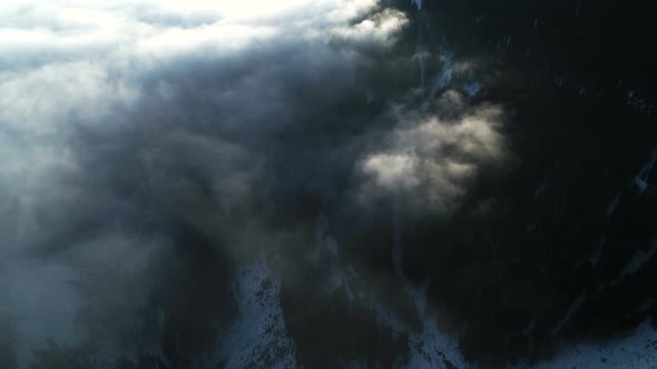 Flying Above Mystic Mountain Valley Covered With Clouds