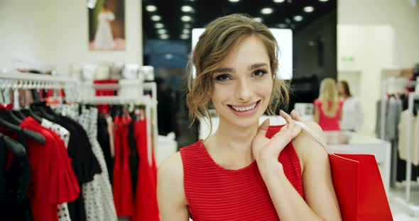 Portrait of Happy Woman After Shopping