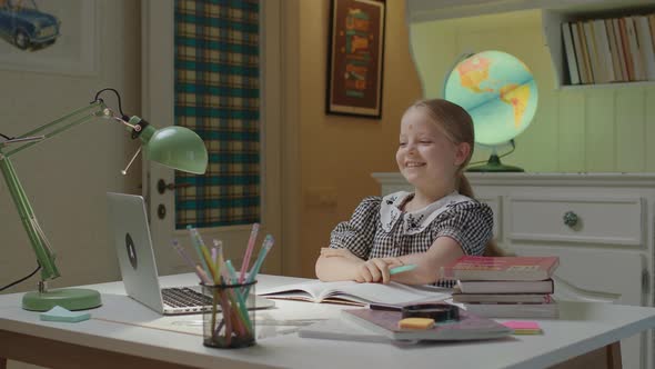 Schoolgirl Sleeping on Book While Remote Learning at Home
