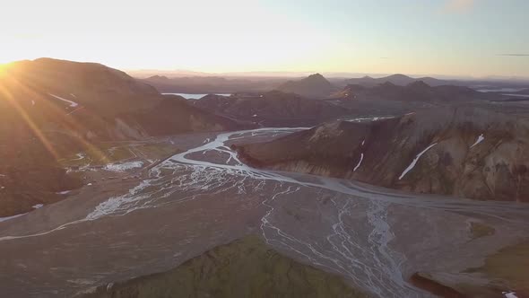 Aerial Sunset over River Delta in Icelandic Mountains alt