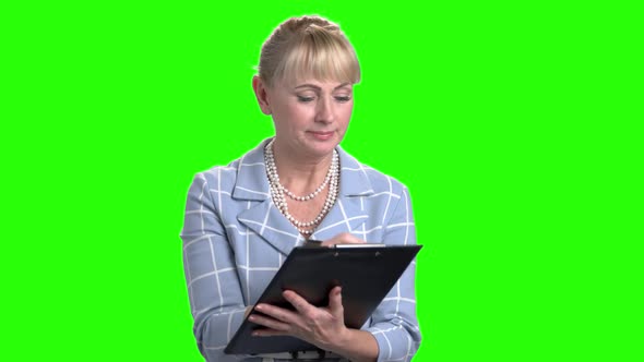 Woman with Clipboard on Chroma Key Background alt