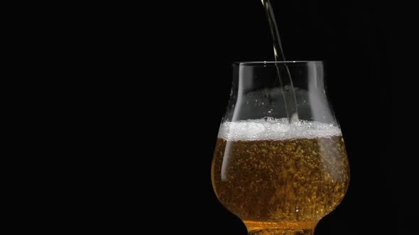 Beer Is Pouring Into Glass