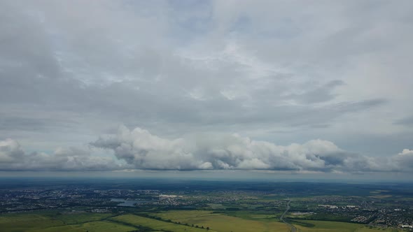 Aerial View From The Field To The City With Rain Clouds In Ukraine