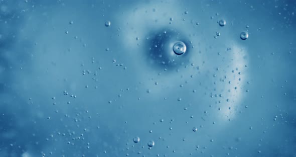 Oxygen Bubbles in Water on a Blue Abstract Background alt