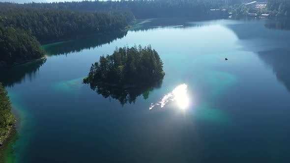 Flight over lake Eibsee with Maximilian island, Bavaria alt