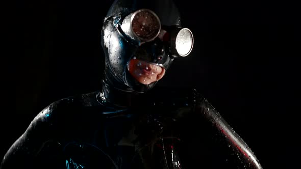 Erotic Fantasy with Bdsm Role Play Woman in Black Latex Suit is Dancing in Water Flows alt