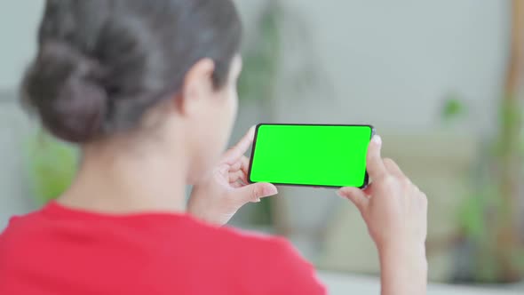 Indian Woman Watching Smartphone with Chroma Screen alt