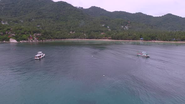 Flying to Tropical Beach near Boats alt