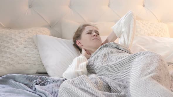 Uncomfortable Sleeping Woman with Neck Pain in Bed alt