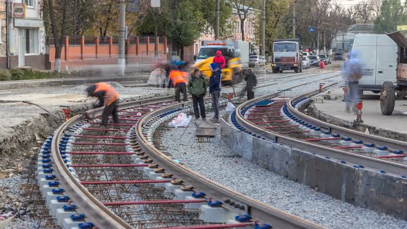 Repair Works on the Street Timelapse. Laying of New Tram Rails on a City Street alt