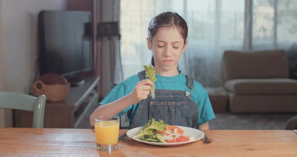 Child nutrition - girl refusing to eat healthy food alt