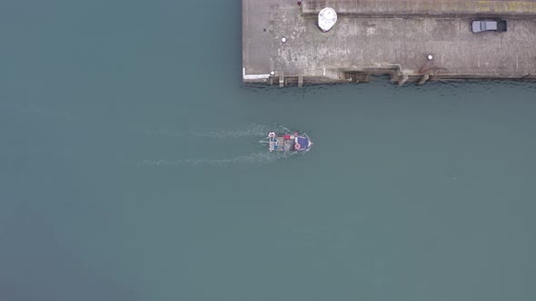 Bird's Eye View of.a Fishing Vessel Returning to Port alt