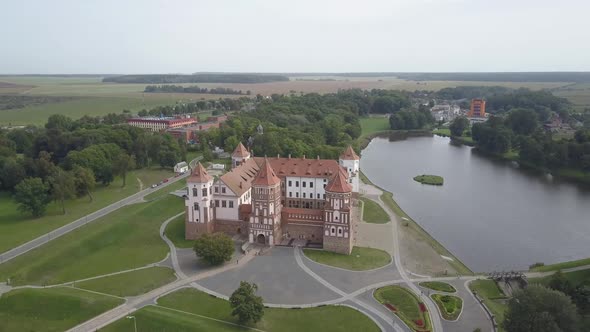 Masterpiece of Architecture of Belarus - Mir Castle Among Lakes and Parks, Aerial View. Flying Over alt
