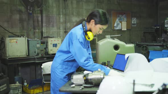 Asian female Professional engineering wearing uniform and safety goggles alt