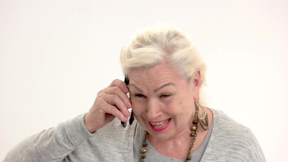 Happy Senior Woman with Phone alt